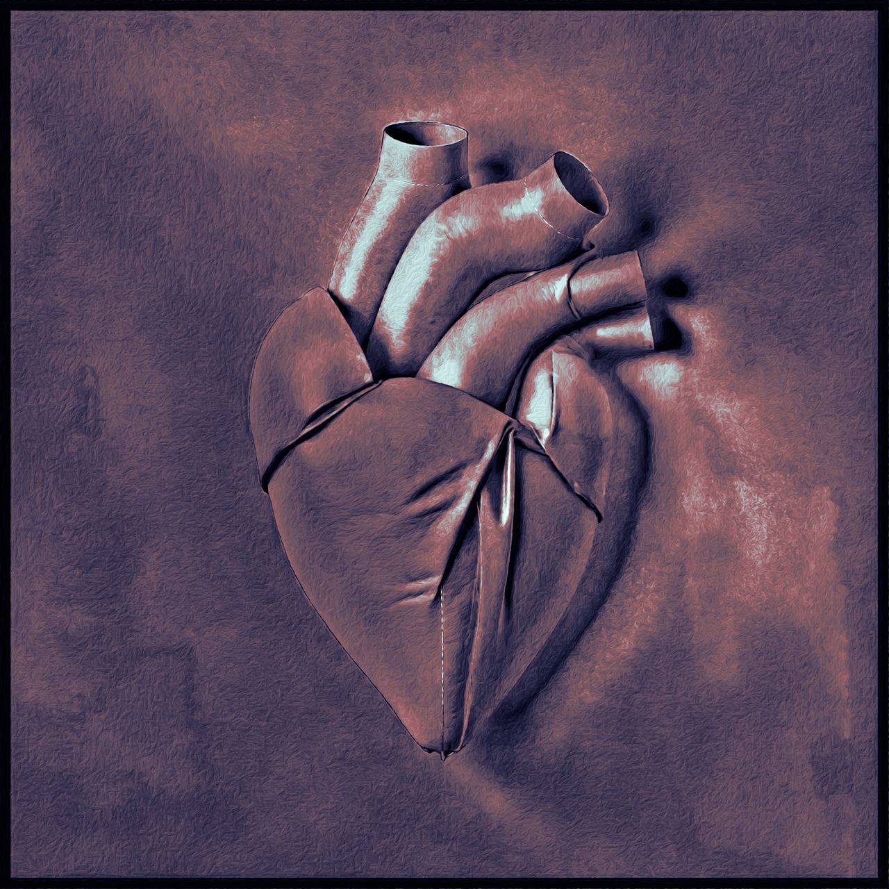 a leather heart piece of art on a table